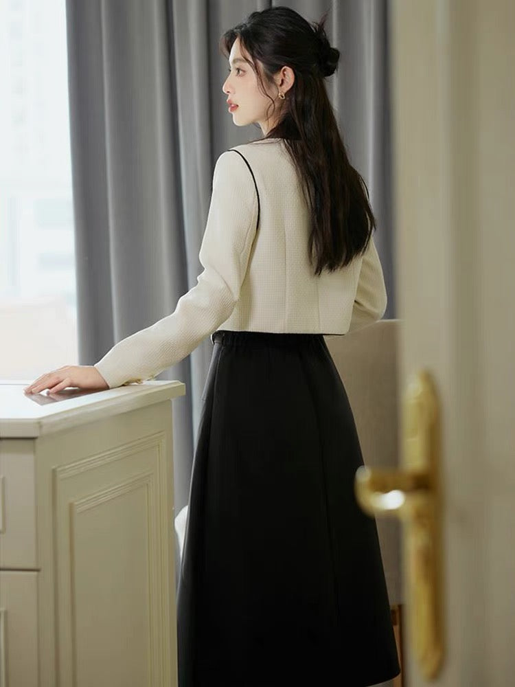 Autumn clothing is matched with a complete set of 2023 new stand-up collar long-sleeved tops and salt-style light and mature style skirts.