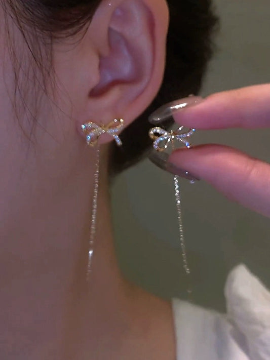 High-end golden bow earrings, long tassel earrings, elegant ear piercing earrings, 2023 new trendy women's thin