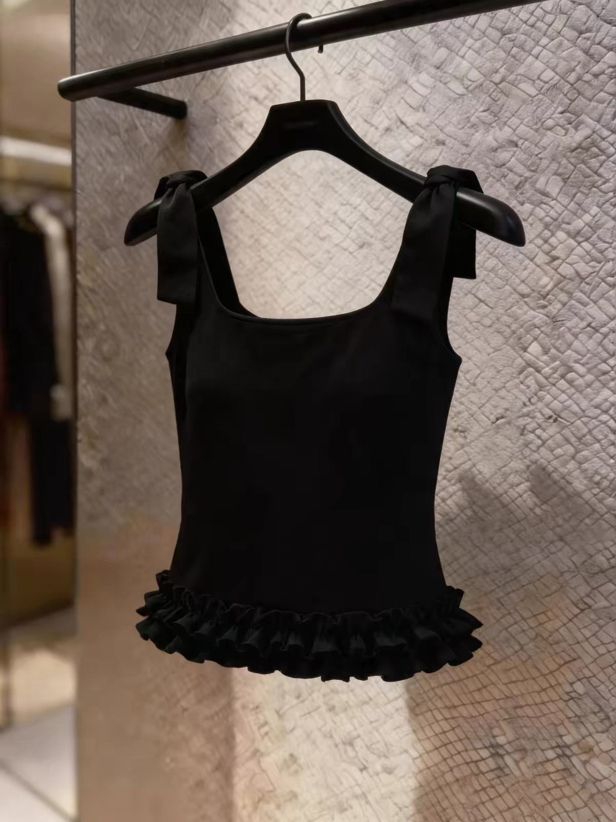 Stunning Korean-style black camisole featuring a bow-tie strap design and ruffled details—a chic, stylish top perfect for work or casual wear.