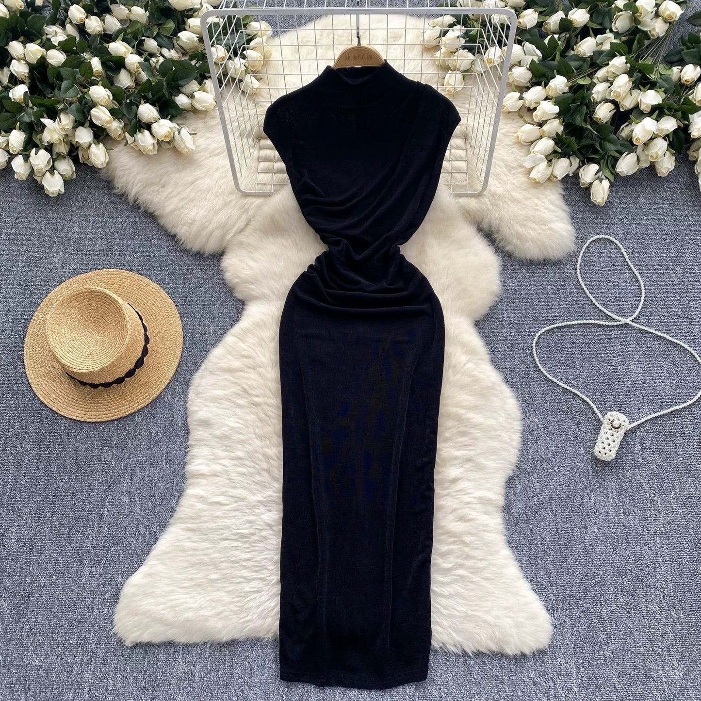 A sophisticated and elegant midi dress with a goddess-like aura, featuring subtle pleats that accentuate the waist and create a slimming effect. A European-style long bodycon dress.