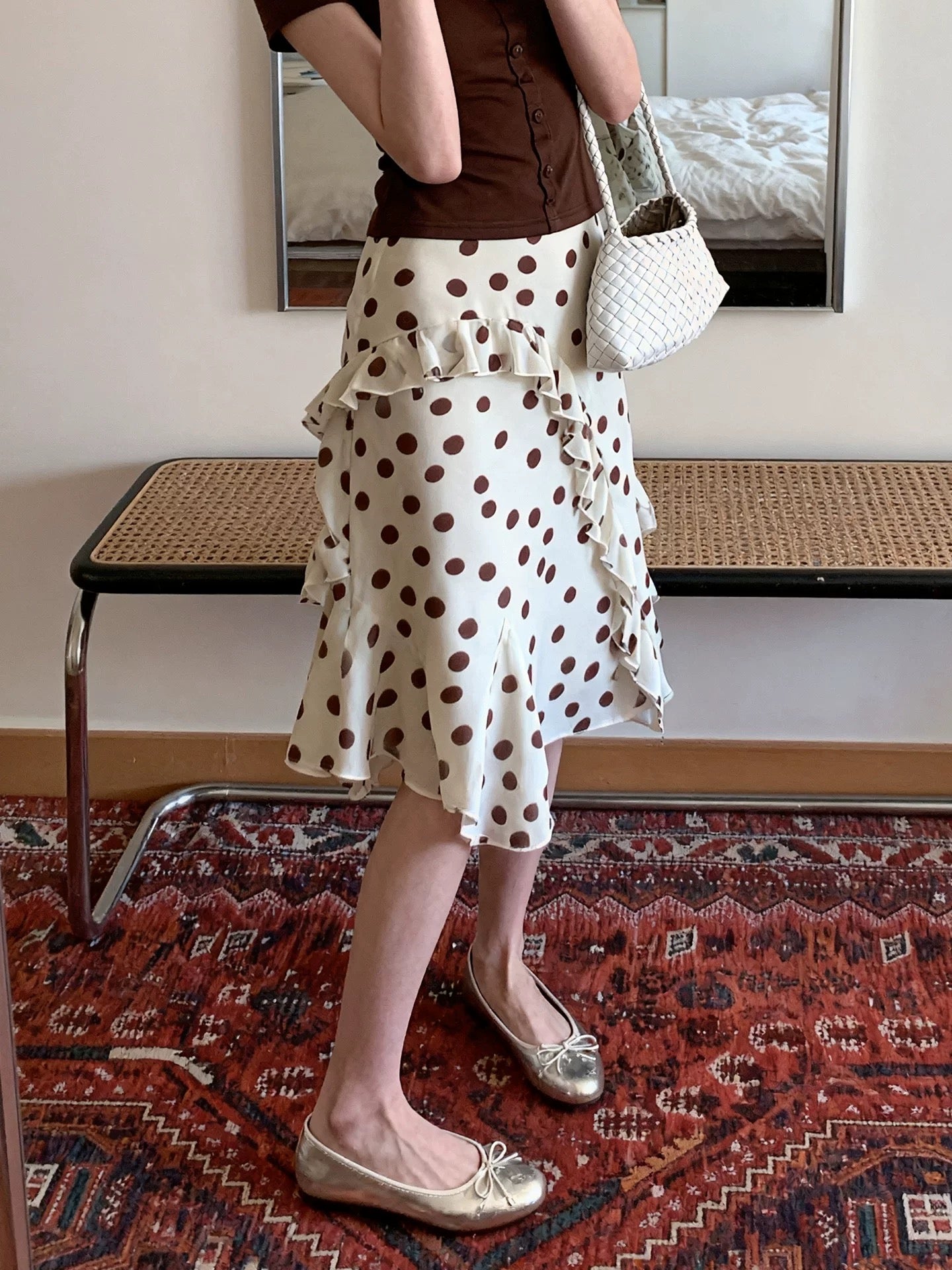 Plus-size yellow irregular ruffle polka dot midi skirt for women, summer French style, high-waisted, elegant, slimming A-line skirt.