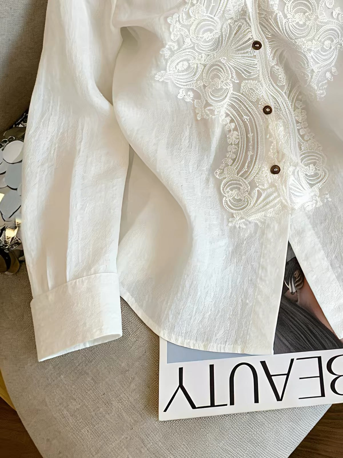 Korean-style long-sleeved shirt featuring intricate lace paneling and a collared neckline—a stylish, relaxed-fit choice for summer workwear or casual outings.