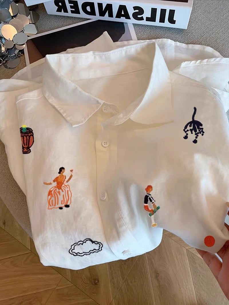 Women's premium-feel white long-sleeve shirt featuring a collar and cartoon print; a versatile, Korean-style, youthful-looking, and unique piece perfect for layering during spring and autumn.