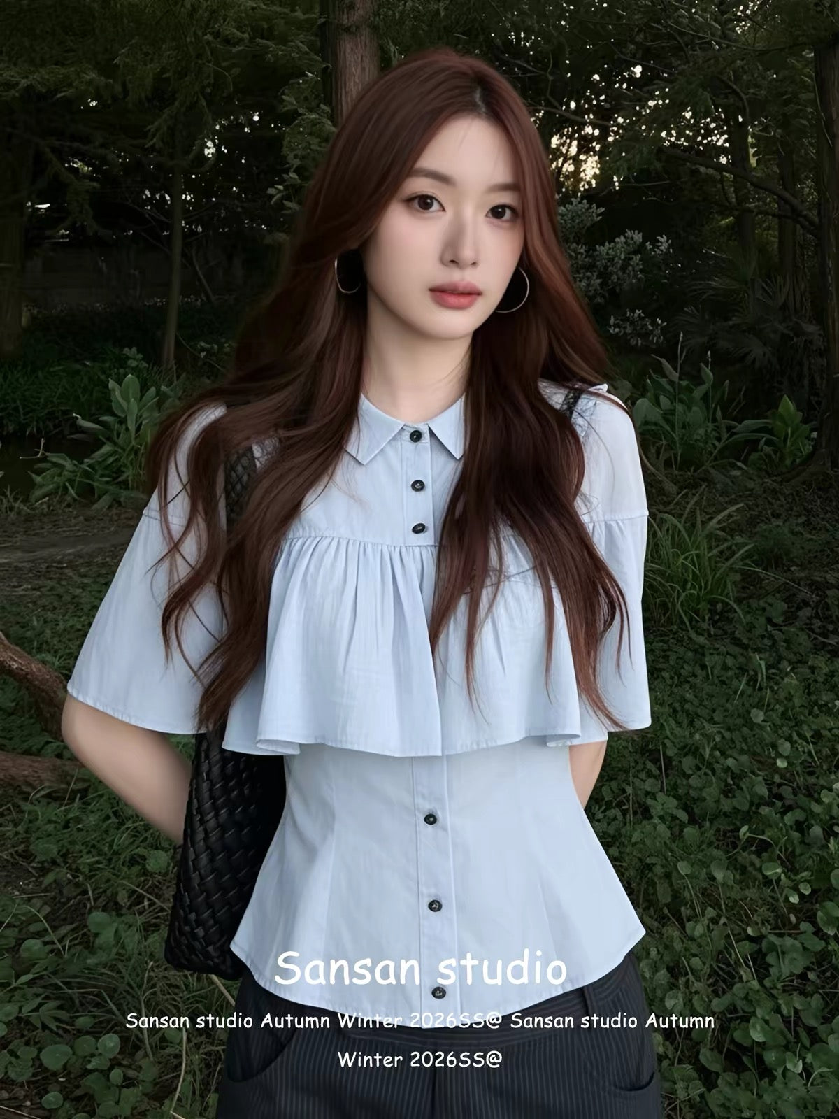 Korean-style blue short-sleeved shirt with a cape-style overlay—a chic, sophisticated summer top featuring a waist-cinching, slimming fit.
