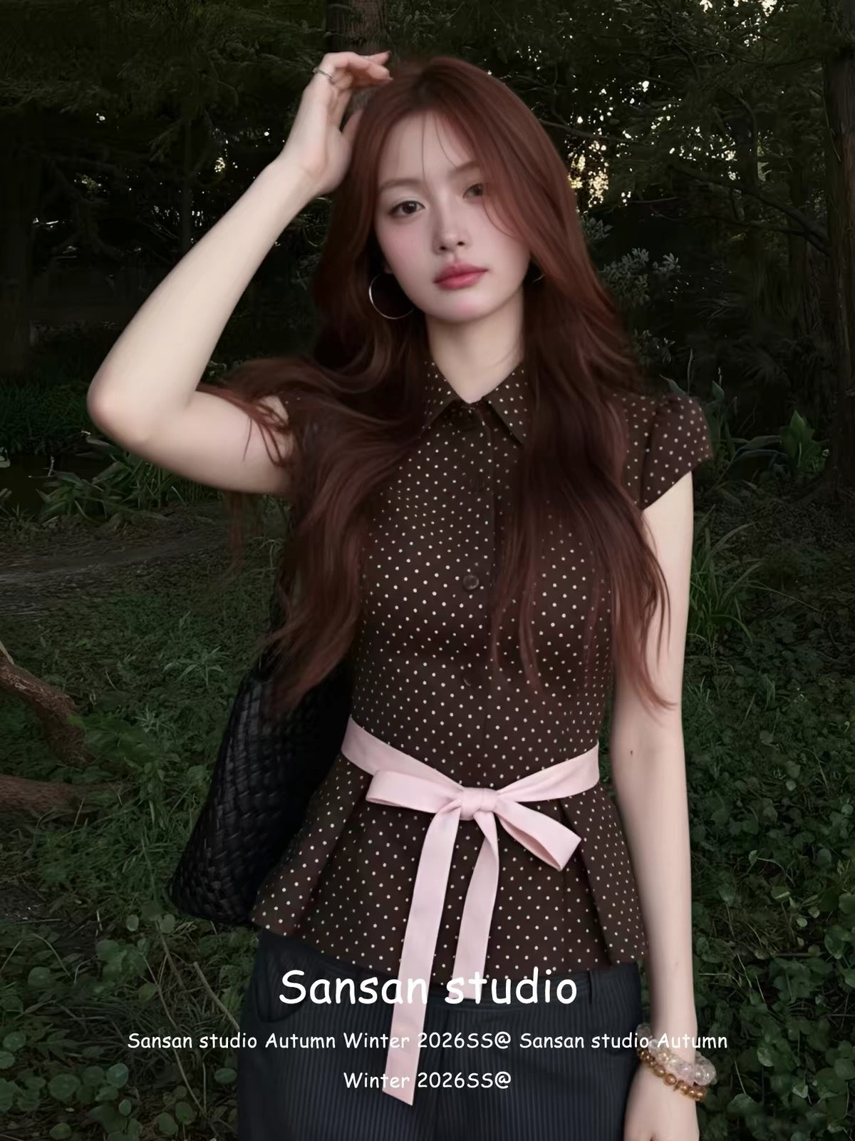 Korean-style polka-dot short-sleeve blouse for women—a summer staple featuring a collared neckline, bow-tie detail, and a waist-cinching cut that creates a slimming, youthful look.