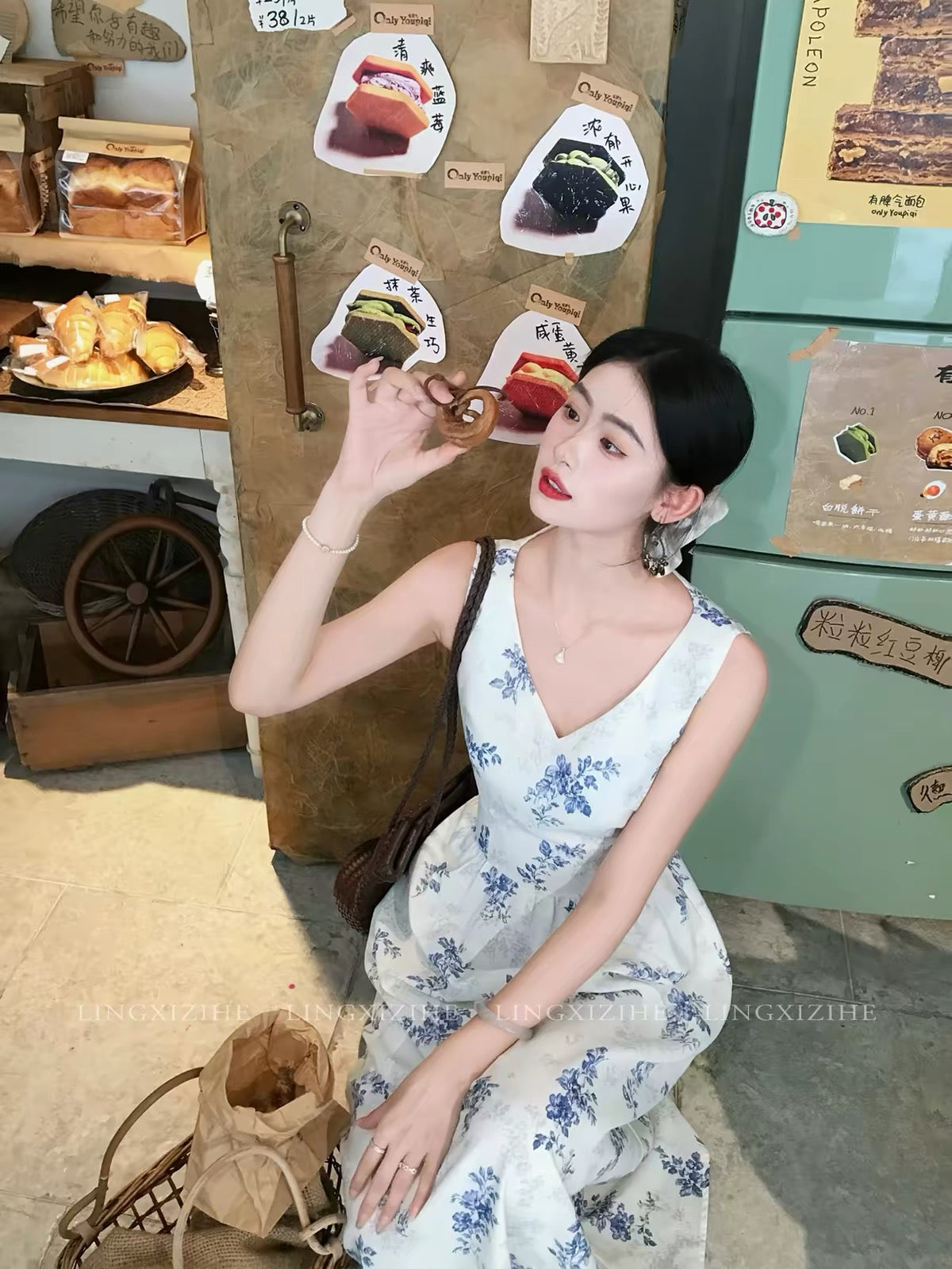 Ling Qian Zi He – French-style blue floral embroidered dress; a summer maxi dress featuring a bow-tie detail.