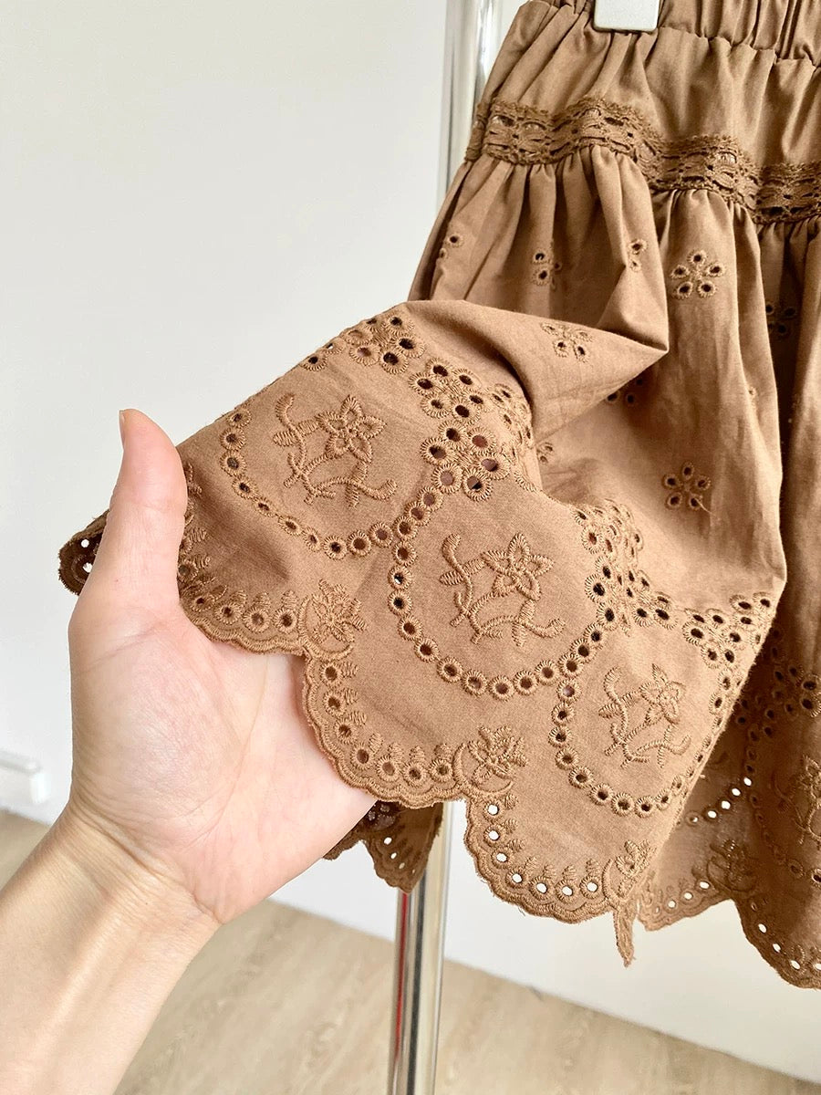 2025 summer new French pure white temperament lace embroidery hollow high waist A-line puffy short skirt female trend