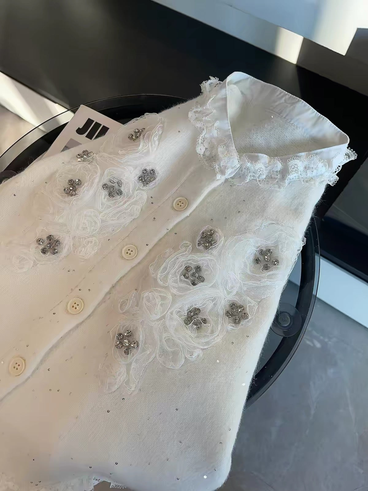 JULY START Early Spring New Arrival: Long-sleeved knit cardigan featuring 3D floral appliqués, rhinestone accents, and lace-trim detailing.
