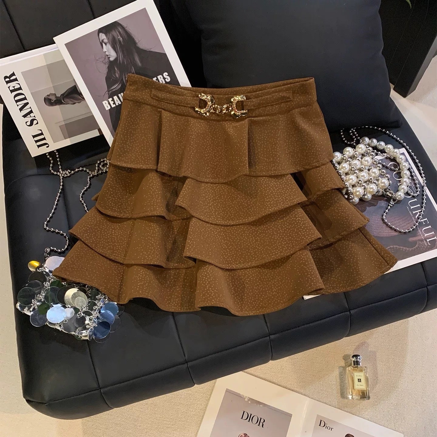 ZHOUYI/Monday: A stylish polka dot PU leather mini skirt with metal buckle, perfect for autumn and winter. It's a high-waisted skirt that flatters the figure.