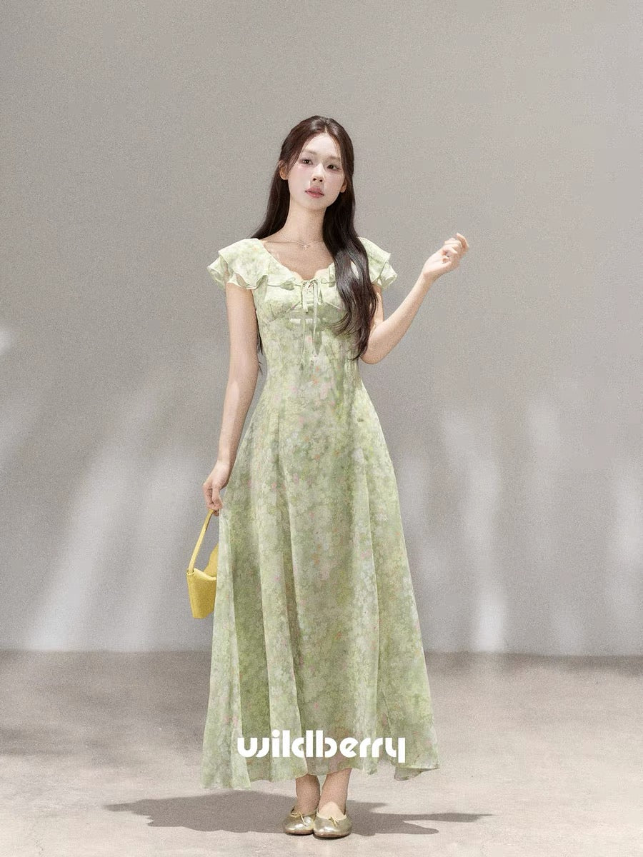A beautiful French-style long dress with a small wild berry green floral print, a new summer 2026 style.