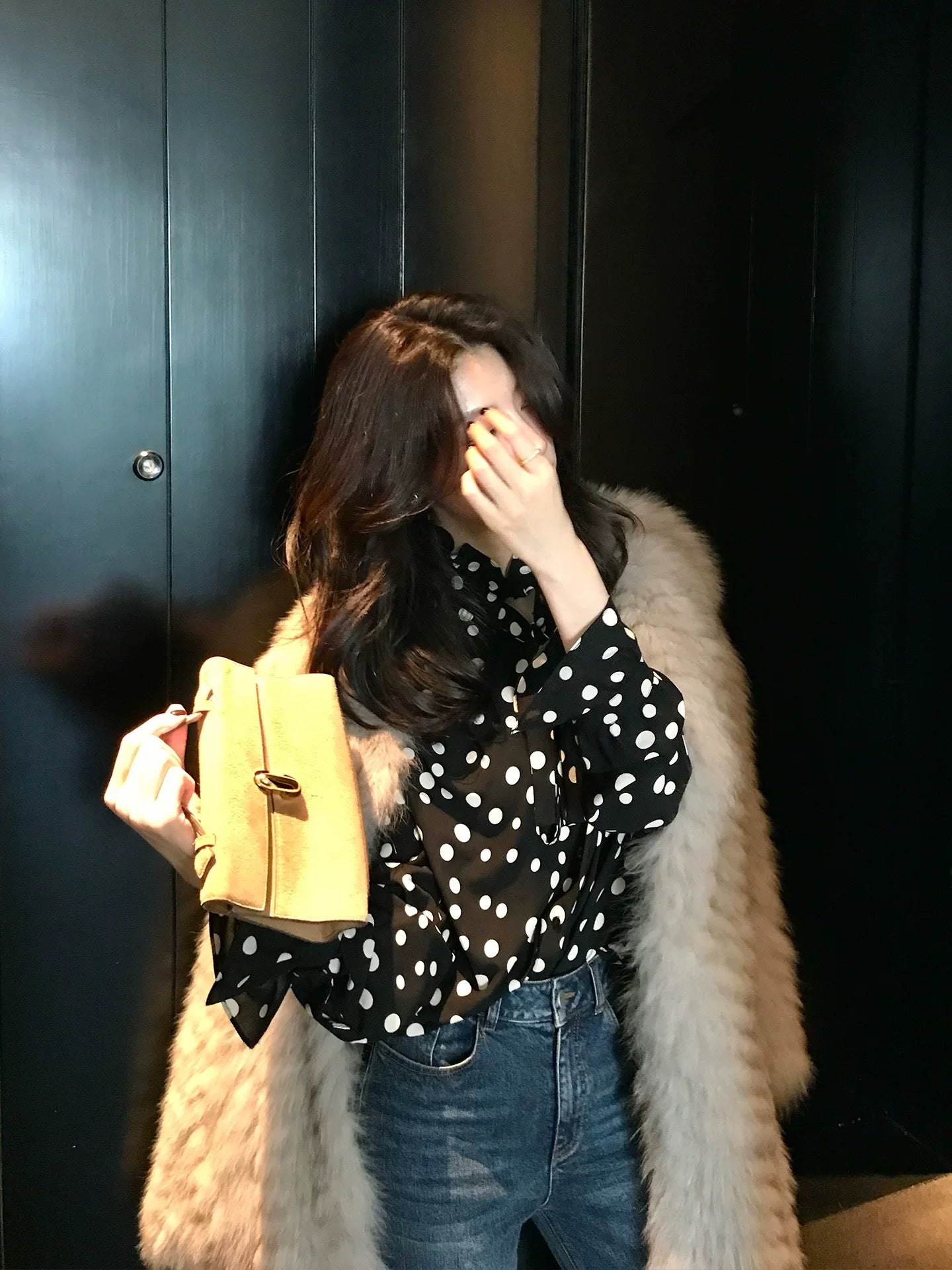 Long Xier, a niche design, featuring a gentle polka dot print lace shirt with a flowing collar, perfect for wearing outside. J380