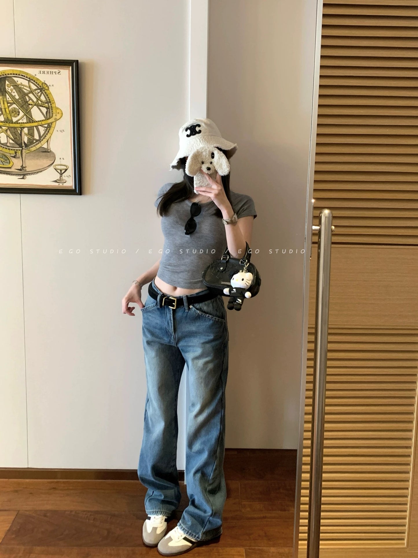 e go studio washed denim jeans in a light blue wash, flattering, versatile, and casual wide-leg trousers.