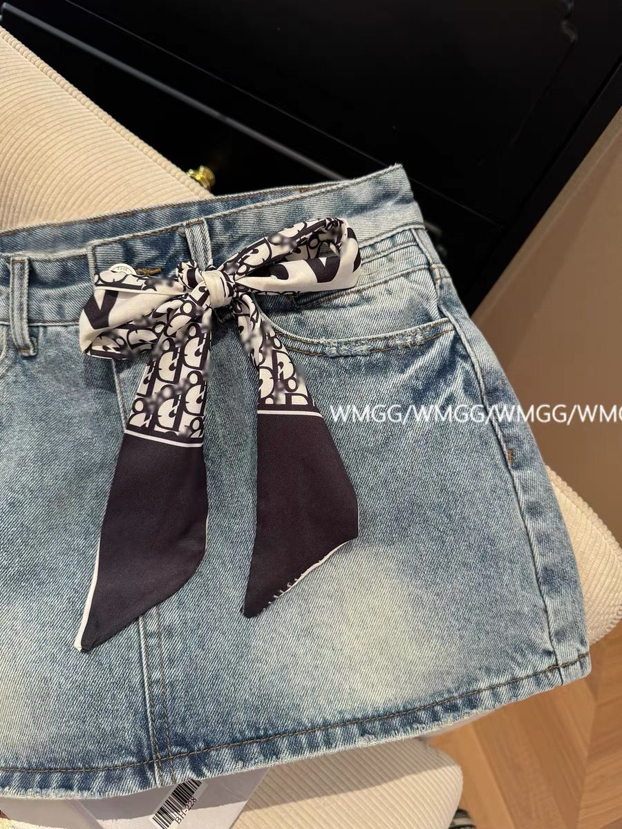 Blue denim mini skirt with bow design, new summer 2026 style, high-waisted, sexy, anti-exposure A-line skirt.