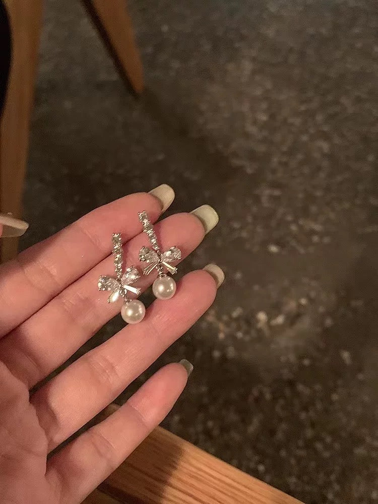 Bowknot pearl earrings 2025 new hot-selling earrings niche design high-end earrings for women without pierced ears ear clips