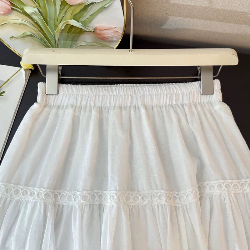 French-style delicate hollowed-out crochet embroidered midi skirt for women, spring 2026, high-waisted A-line pleated flared skirt.