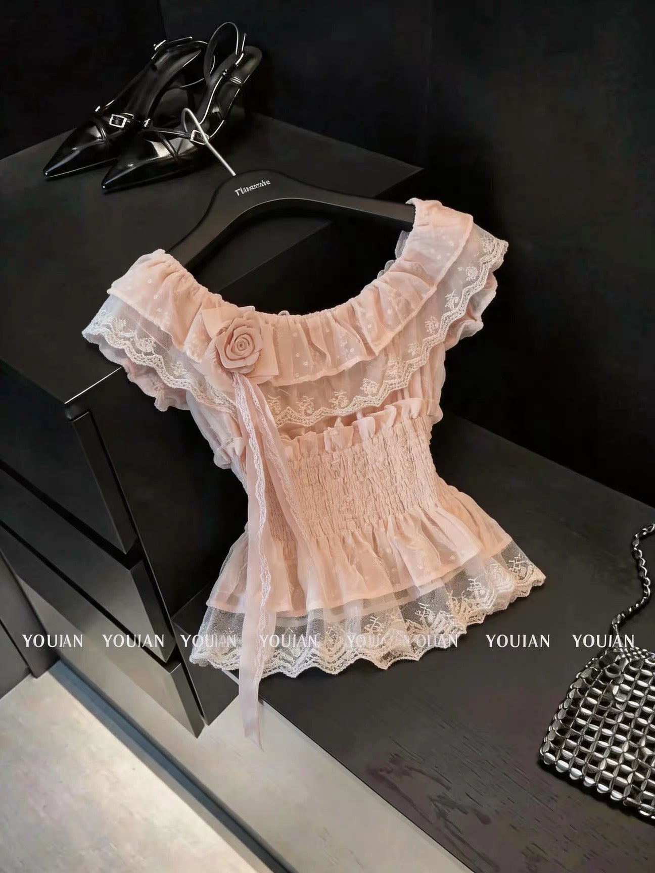 French-style chic, pretty off-the-shoulder short-sleeved blouse with ruffles and three-dimensional flowers; sophisticated, unique, and ethereal.