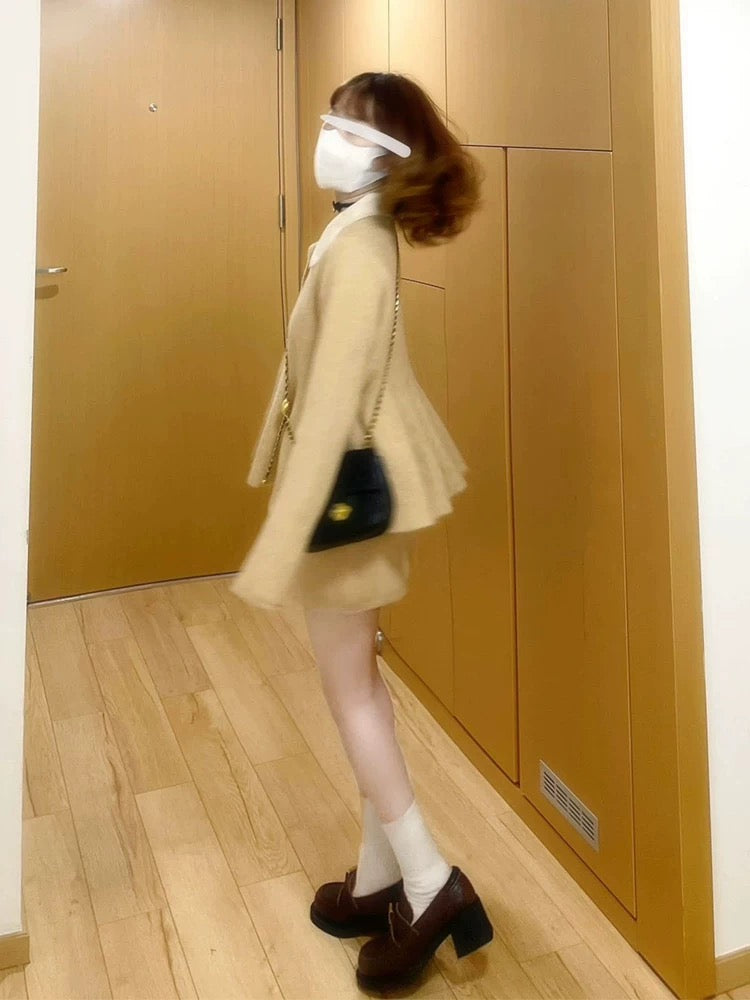 A sophisticated Korean-style Chanel-inspired two-piece winter outfit: a Peter Pan collar knit sweater and skirt set.