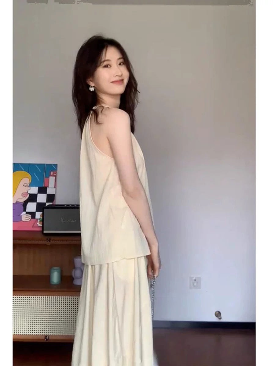 Cream yellow halterneck top, high-waisted skirt, two-piece set for women, French pleated temperament suit, summer gentleness