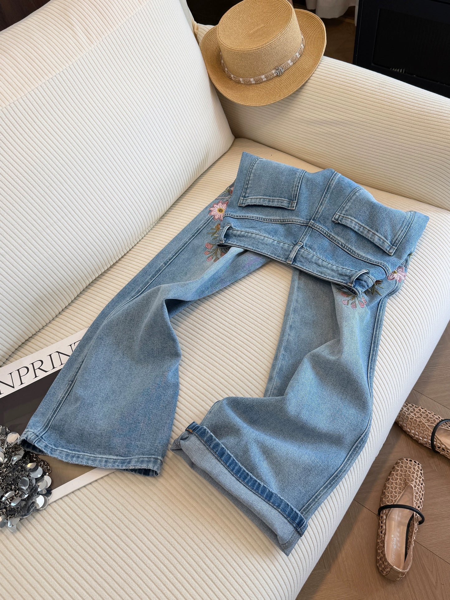 Light blue floral embroidered high-waisted straight-leg jeans for women, new summer 2026 style, flattering wide-leg pants.