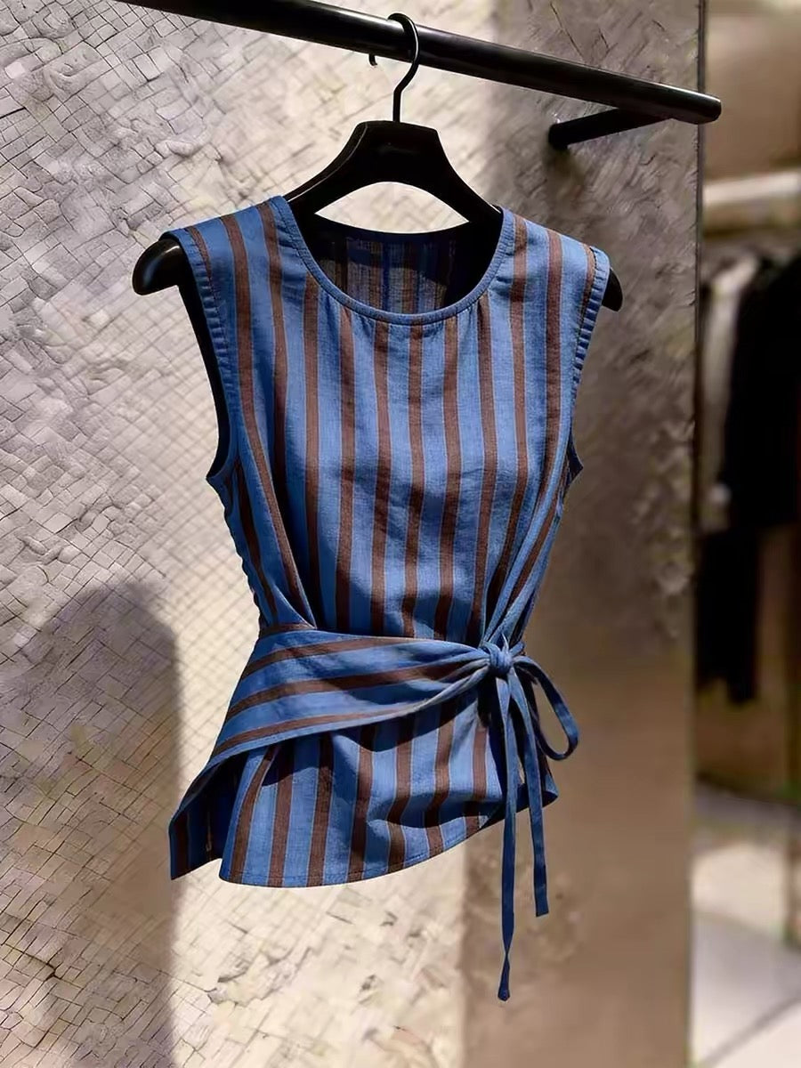 Stylish blue sleeveless top featuring vertical stripes, a self-tie waist, and a sophisticated, unique design—perfect as a chic summer layering piece.
