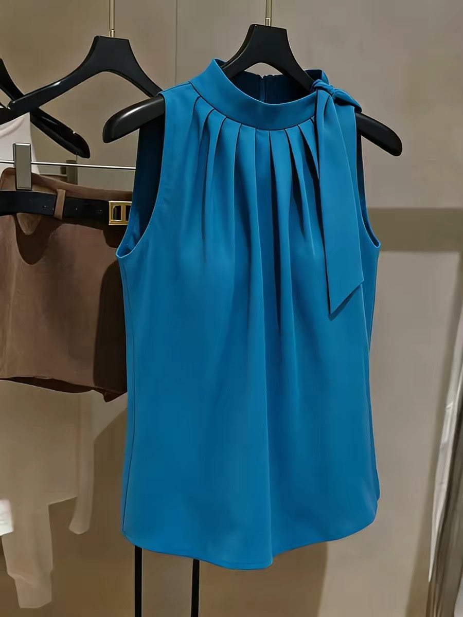 Chic French-style blue halter-neck chiffon top—a sophisticated, versatile, and pleated sleeveless blouse for women.