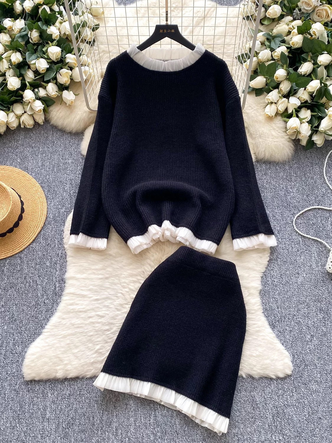 Gentle and elegant style for women's autumn and winter: long-sleeved loose knit top with ruffled trim and high-waisted bodycon skirt.
