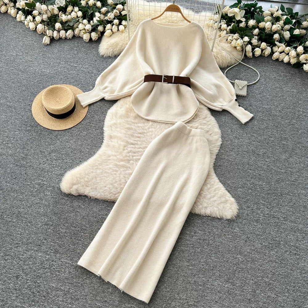 A sophisticated two-piece women's fashion set featuring a tie-waist, batwing sleeve knit top and a high-waisted pencil skirt.