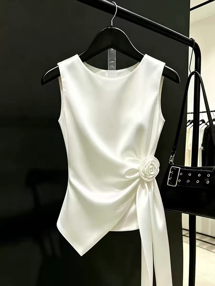 Stunning new summer top: an affordable luxury, niche-style white sleeveless blouse featuring 3D floral details and ribbon ties—a unique, eye-catching piece.