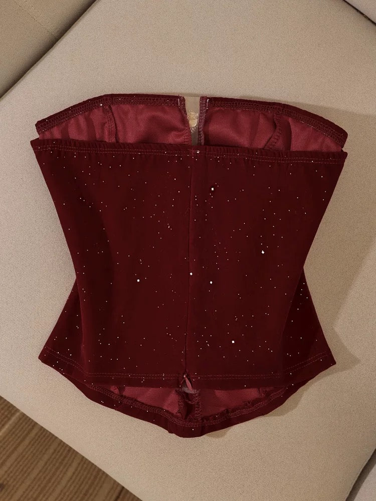Christmas outfit: Strapless bow camisole top layered over a suit jacket; sexy off-the-shoulder tube top for women.
