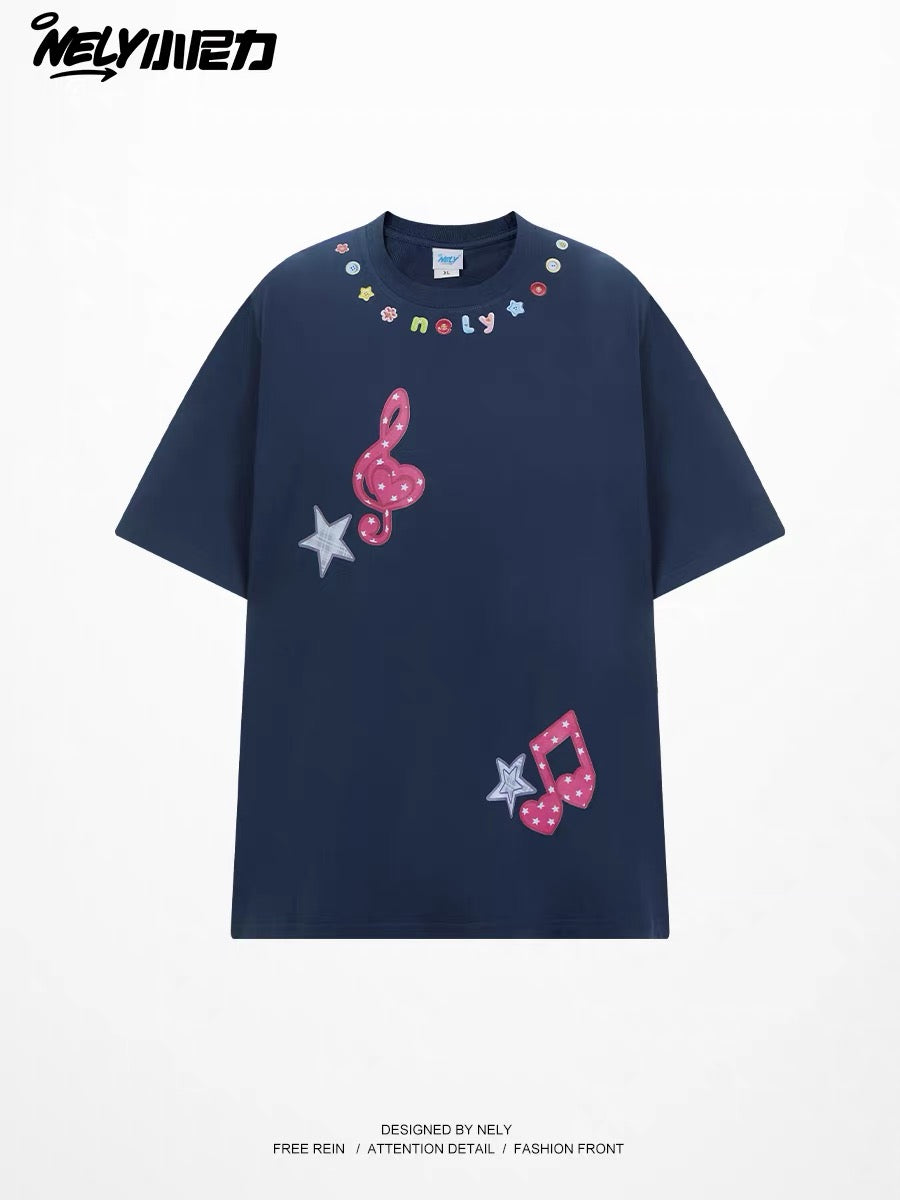 Unisex loose-fit short-sleeve T-shirt featuring a musical note and star appliqué; a versatile, casual crew-neck top with a unique, distinctive design.