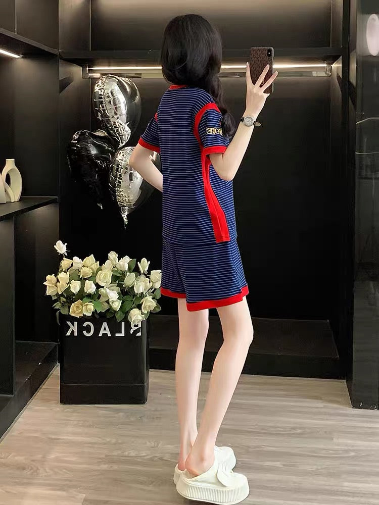 Stylish, trendy, and youthful women's summer two-piece set featuring a striped short-sleeve top and shorts—a loose, casual, and sporty outfit perfect for fitness and running.