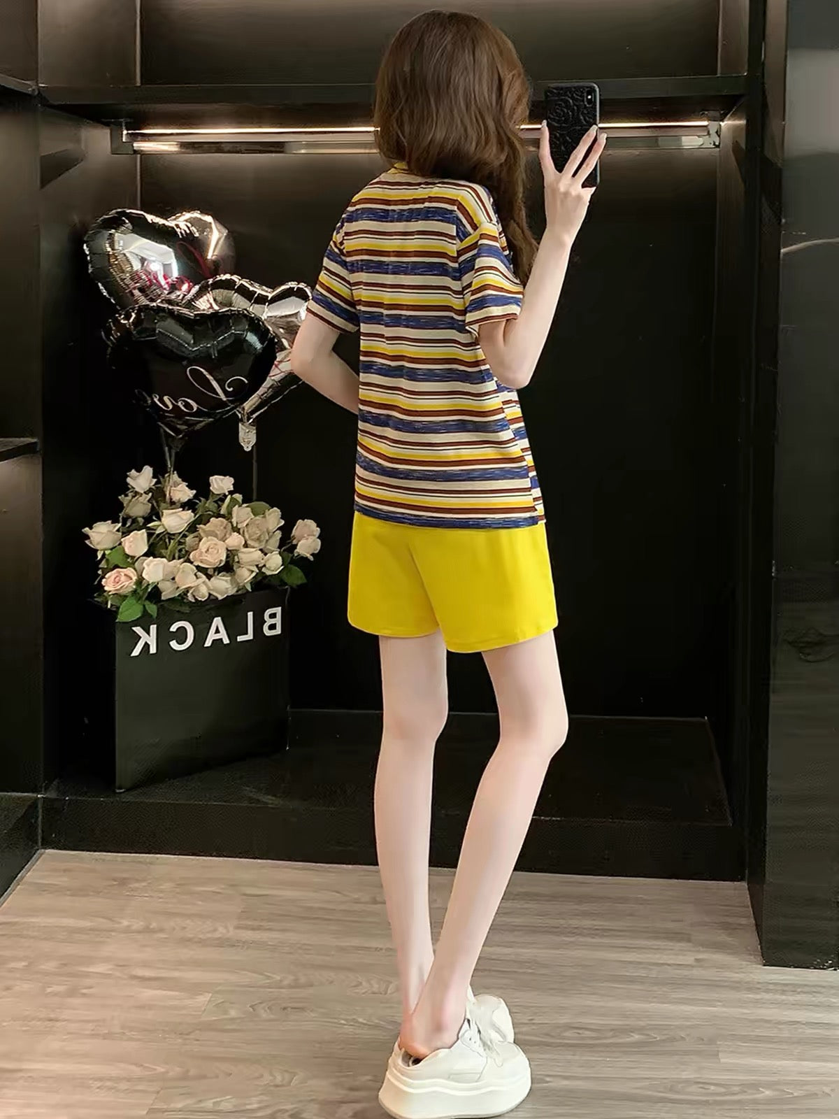 Stylish and trendy striped short-sleeve two-piece set for women (Summer 2026)—casual, sporty, and slimming; features a loose, youthful fit.