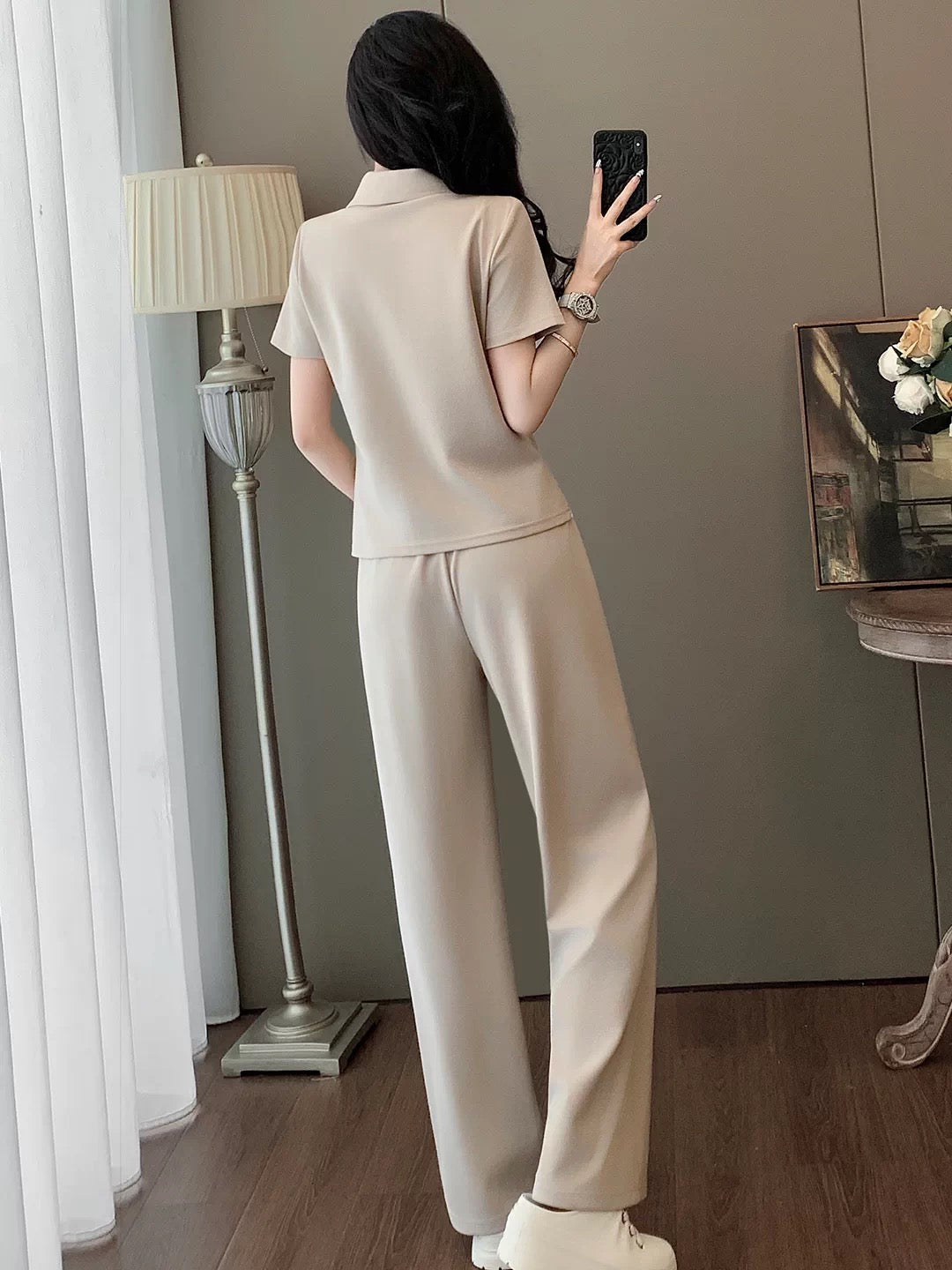 Ultra-chic European-style women's casual sportswear set for summer—a fashionable, youthful two-piece outfit featuring a "faux-layered" short-sleeve T-shirt and wide-leg trousers.