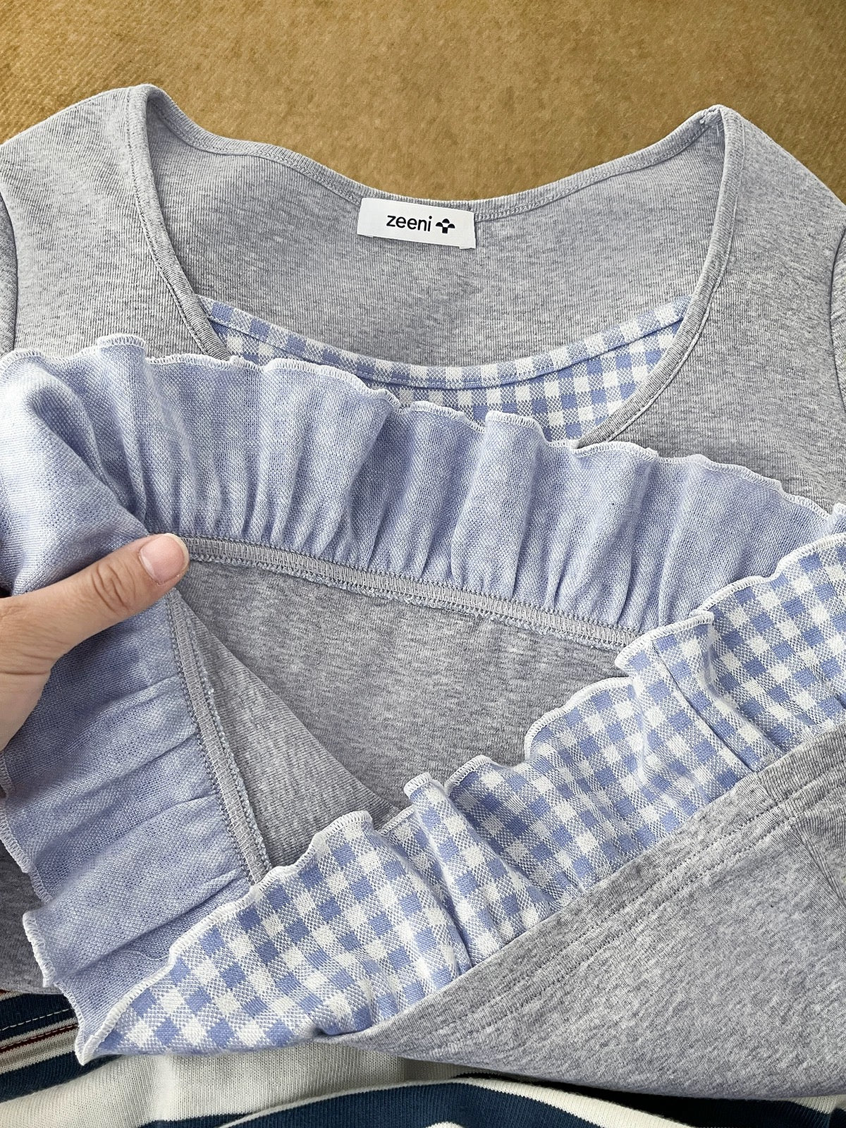 Beautiful knock! Niche original design splicing fake two-piece long-sleeved bottoming T-shirt for women 2025 spring tops
