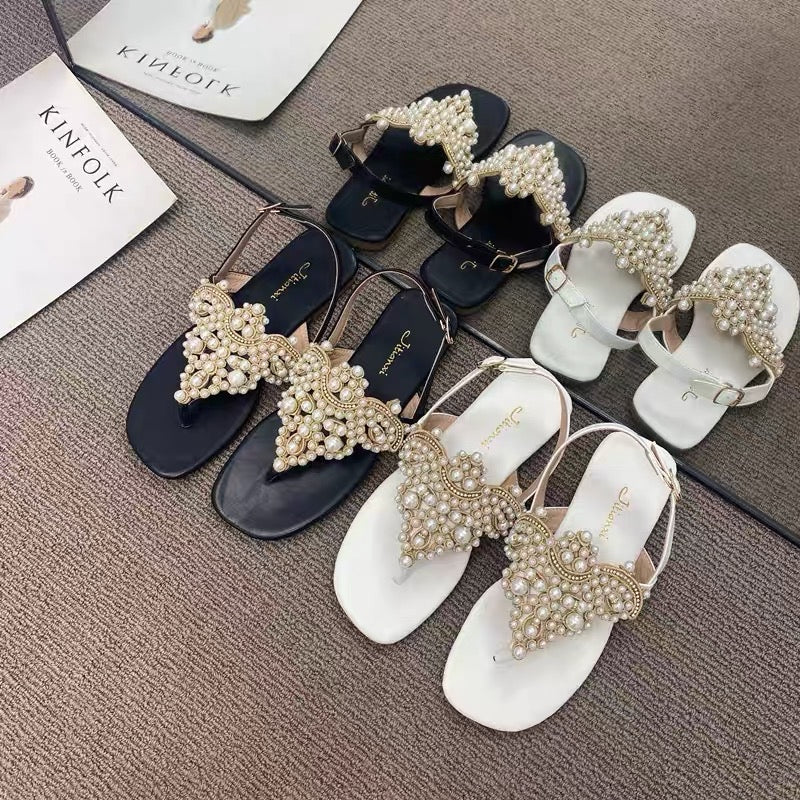 Temperament model ~ close your eyes and enter!  One word buckle strap clip toe pearl fairy sandals female clip feet rhinestone beach flat shoes