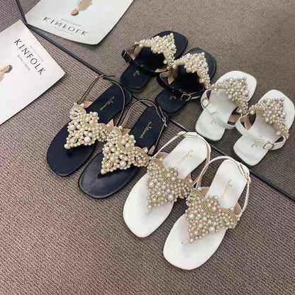 Temperament model ~ close your eyes and enter!  One word buckle strap clip toe pearl fairy sandals female clip feet rhinestone beach flat shoes