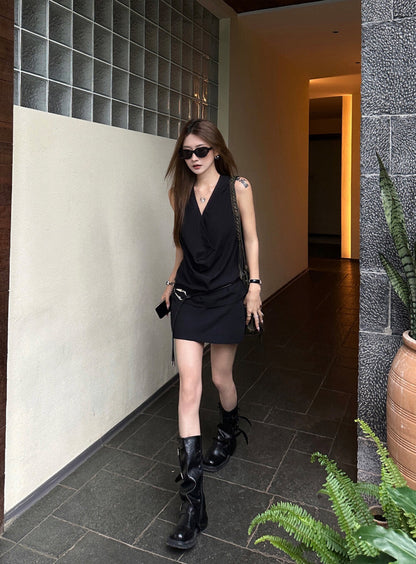 Elegant sleeveless draped-neck top with a high-waisted A-line skirt. Includes a belt and built-in safety shorts for a chic, polished look.