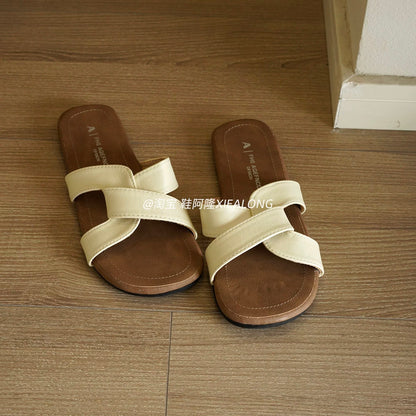 French-style minimalist flat slide sandals for women—featuring a crossover strap design, suitable for casual outdoor wear, vacation, and the beach (2026 Summer New Collection).