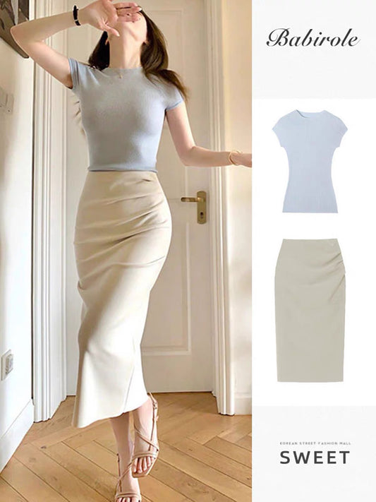 High-waisted, slimming, midi-length, hip-hugging skirt featuring a unique, stylish "Hong Kong vibe" design—perfect for a youthful yet sophisticated look.