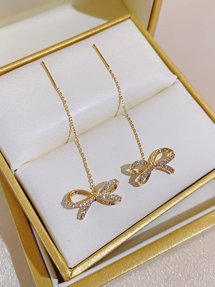 High-end golden bow earrings, long tassel earrings, elegant ear piercing earrings, 2023 new trendy women's thin