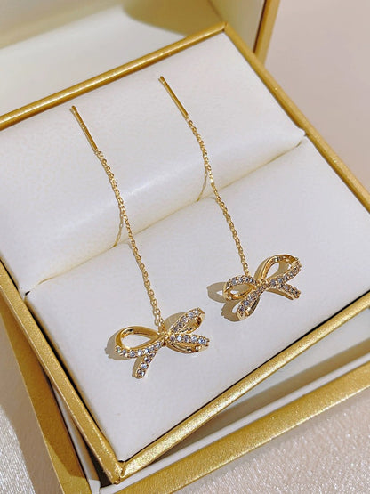 High-end golden bow earrings, long tassel earrings, elegant ear piercing earrings, 2023 new trendy women's thin