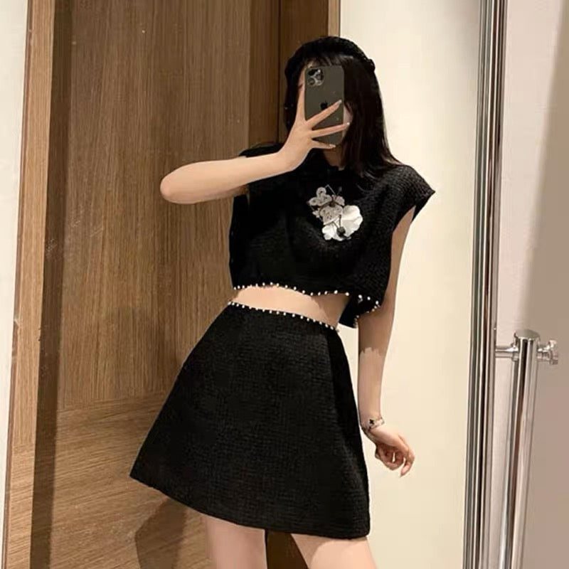 Xiaoxiang celebrity style black suit 2023 new pearl three-dimensional flower sleeveless short top A-swing skirt suit