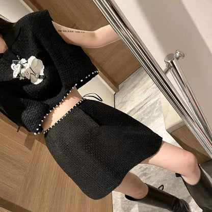 Xiaoxiang celebrity style black suit 2023 new pearl three-dimensional flower sleeveless short top A-swing skirt suit
