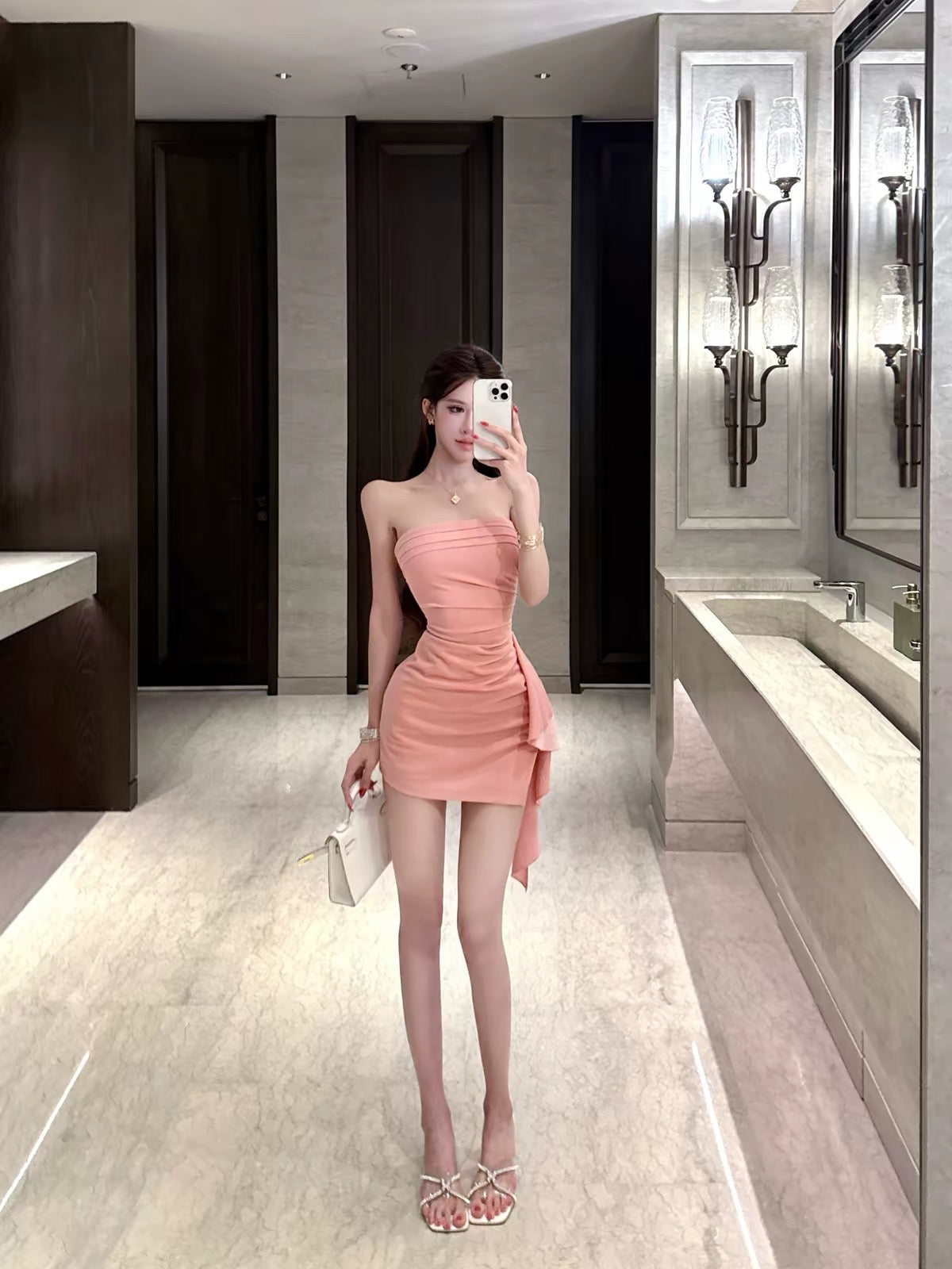 Women's off-shoulder, strapless, form-fitting dress—a stylish, sexy, and elegant piece featuring an open-back design, perfect for the early autumn season.