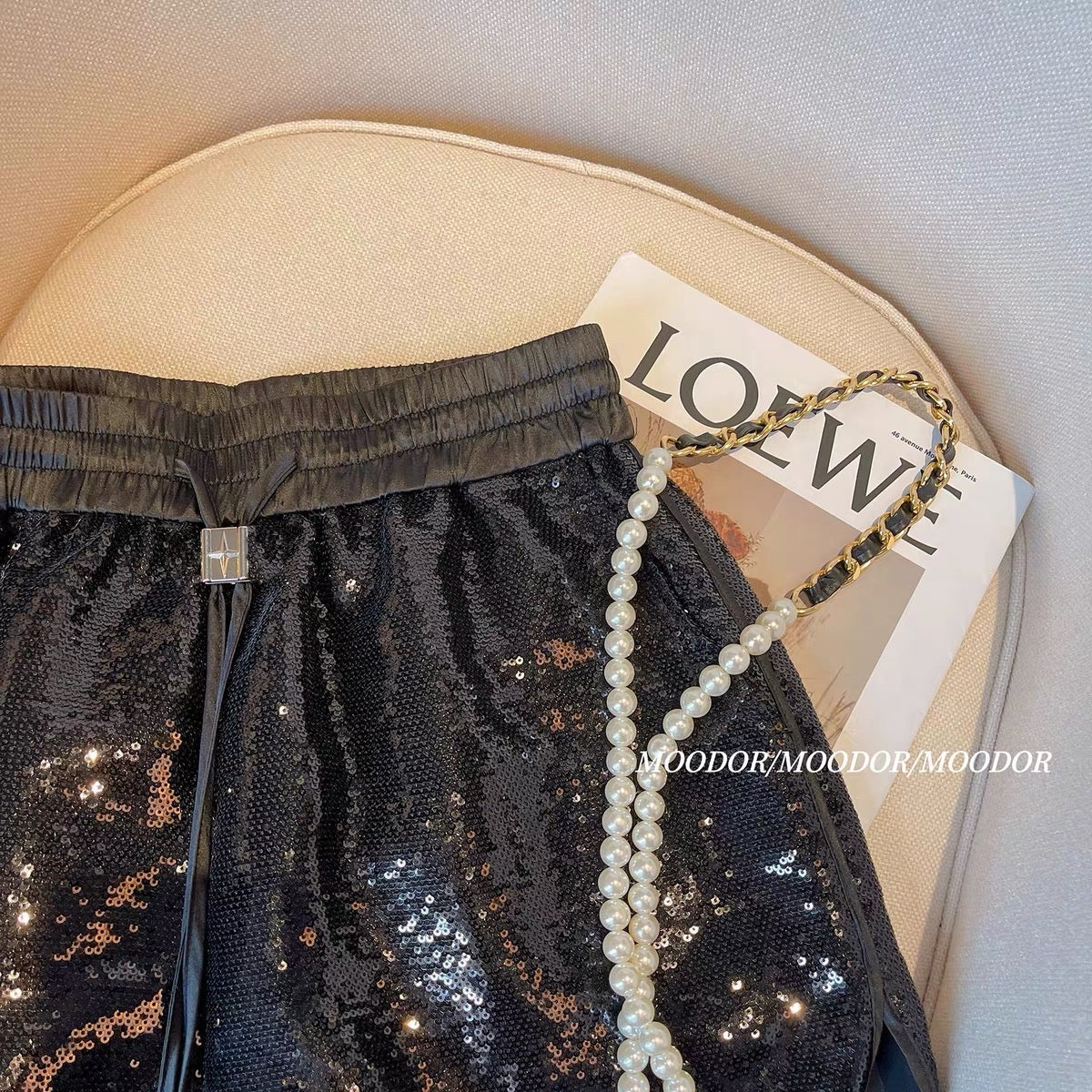 Black sequined shorts women's summer shiny elastic waist drawstring A-line fried street hot pants European high-end pants