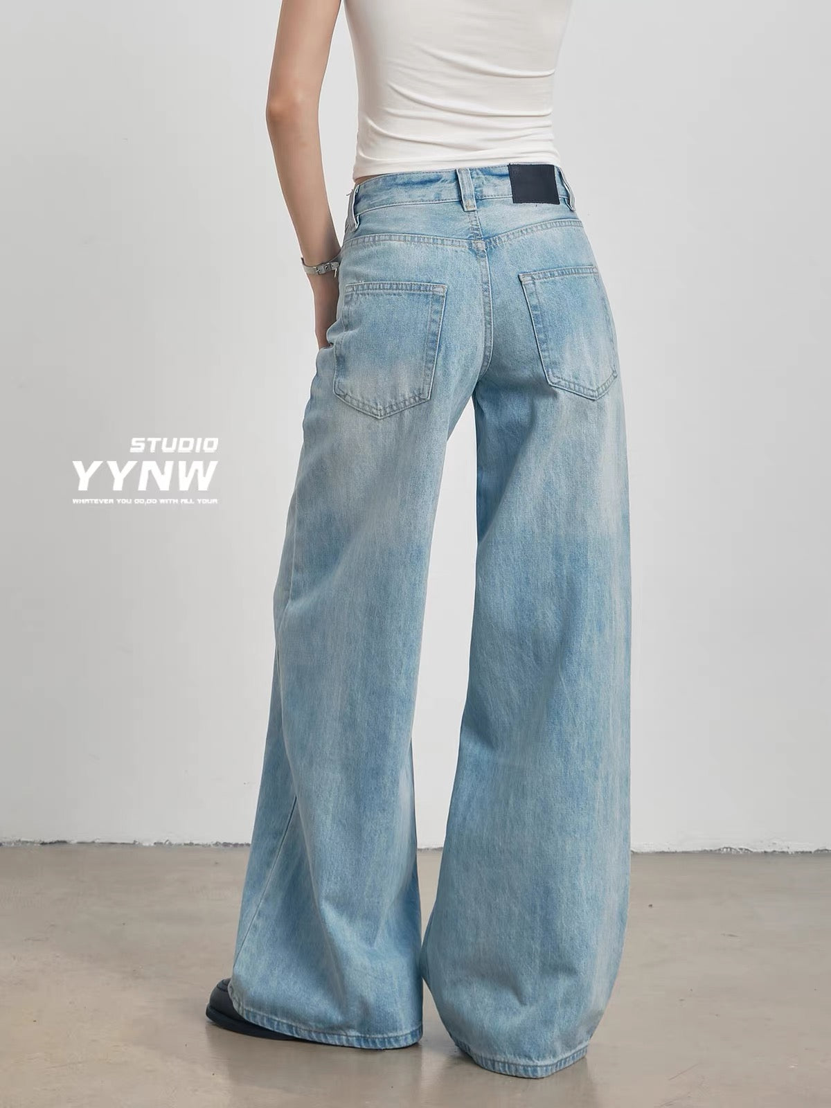 Women's American-style light blue wide-leg jeans (Summer 2026 new arrival): loose, slimming, casual floor-length style featuring distressed rips and abrasions.