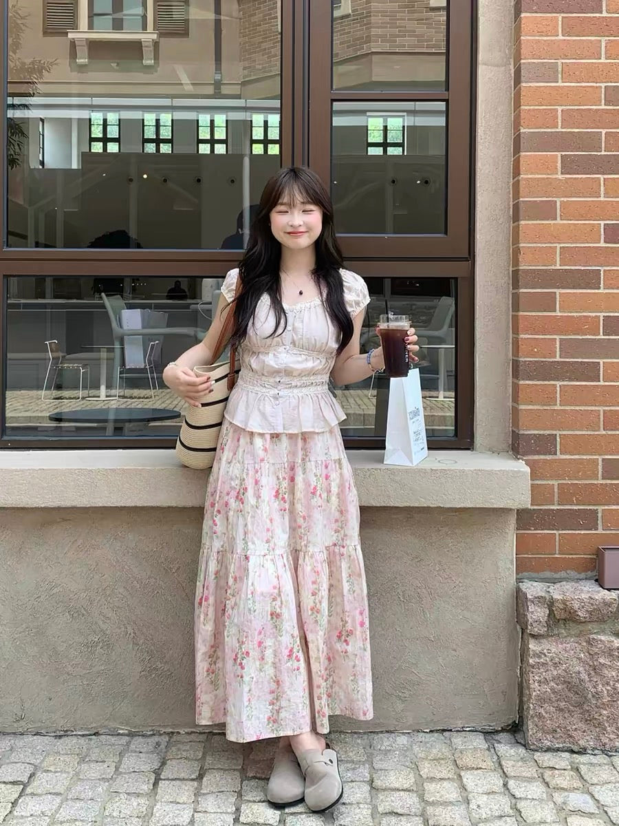 A sweet and slimming two-piece set for women, featuring a gentle, pastoral style floral print top and skirt.