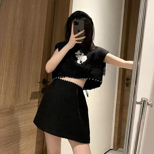Xiaoxiang celebrity style black suit 2023 new pearl three-dimensional flower sleeveless short top A-swing skirt suit