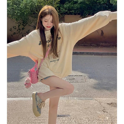 High-end and super good-looking apricot color right shoulder sweatshirt 2023 autumn and winter velvet thickened round neck top for women