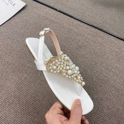 Temperament model ~ close your eyes and enter!  One word buckle strap clip toe pearl fairy sandals female clip feet rhinestone beach flat shoes